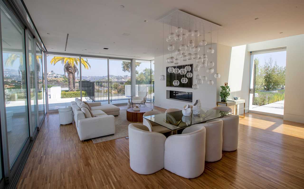 white chairs in a room at mansion The One Bel Air