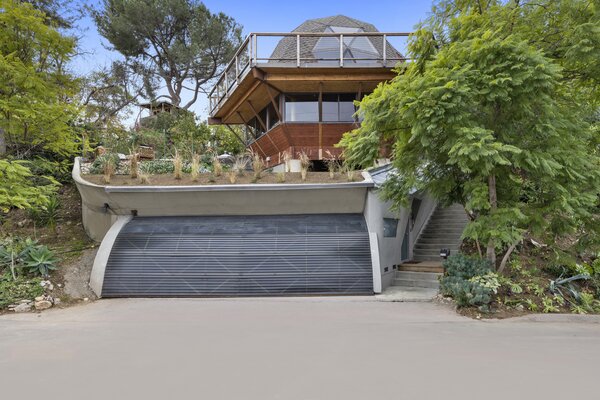 Towering trees surrounding the landmark residence provide plenty of shade and privacy.