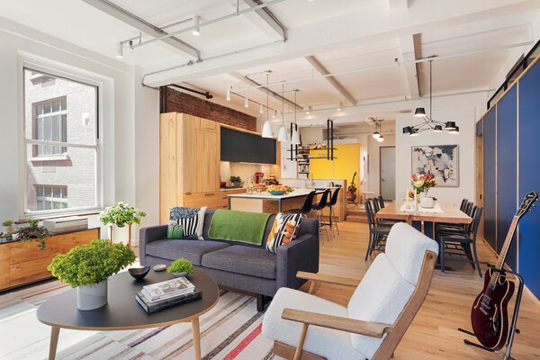 Architect Andrew Franz used reclaimed timber extensively in this renovation of a loft apartment in New York's Chelsea, transforming a small space into a bright and comfortable home for four. The building dates from around 1908 and was probably originally a textiles factory.