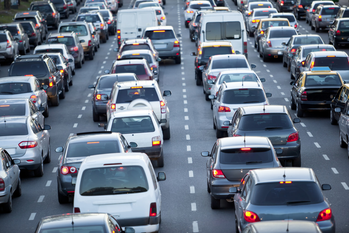 Cars in rush hour with traffic at dawn. Getty