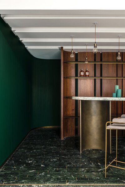 Deep Greens and Gold in This Renovated Apartment Exude Art Deco Opulence