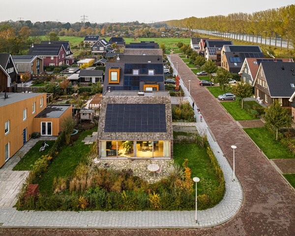 By making their new home in a suburb of Amsterdam much smaller than the maximum allowed, architects Arjen Aarnoudse and Farah Agarwal managed their energy needs while increasing their outdoor space.