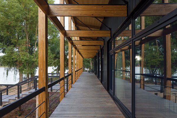 A covered deck runs the length of the structure, its deep overhang helping to regulate solar gain. The home, certified a Passive House by the Passive House Institute, is highly insulated and airtight. 