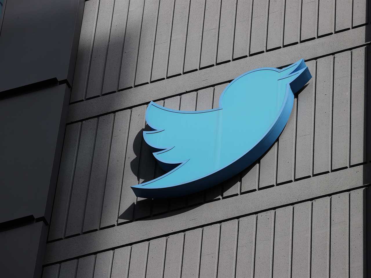 Large blue Twitter bird on a gray building