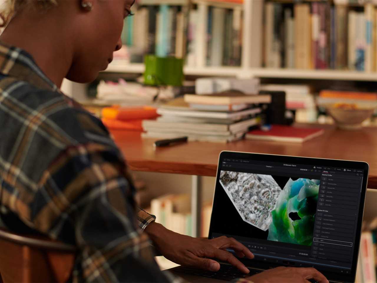 A person using a MacBook Pro 2023 model