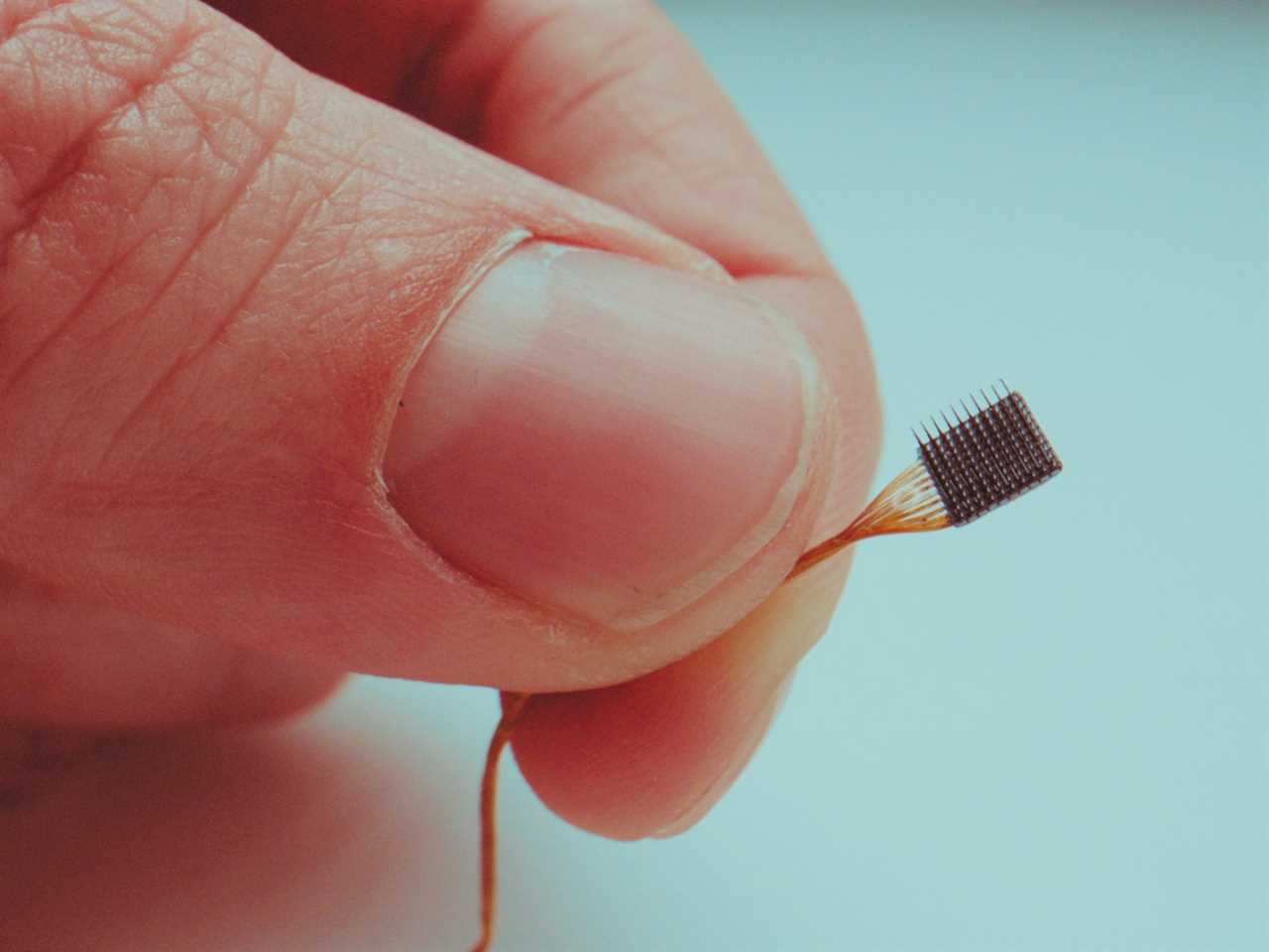 A tiny computer chip, designed to be implanted in a person's brain to help control digital devices