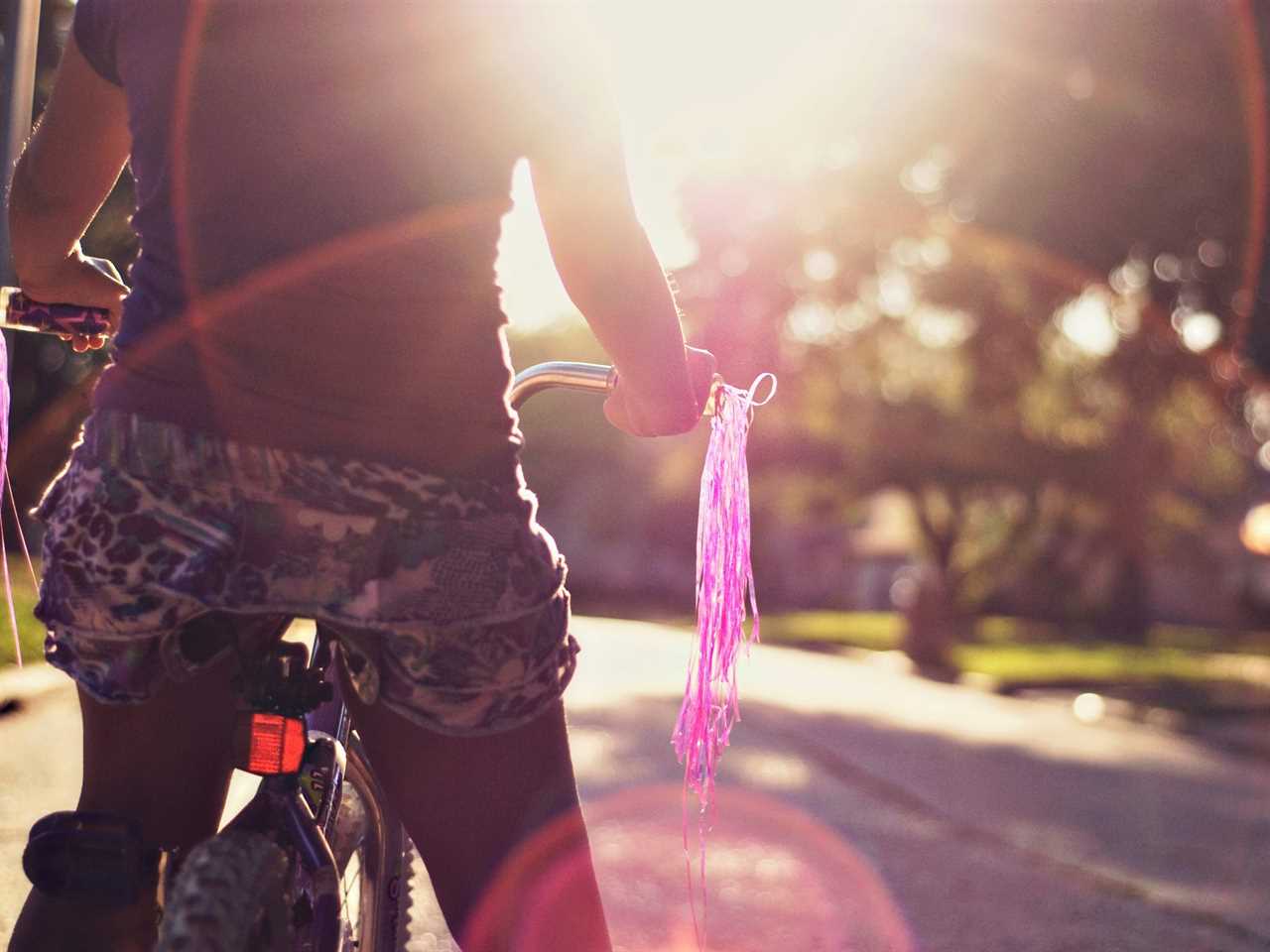 girl on bicycle in a Houston suburb