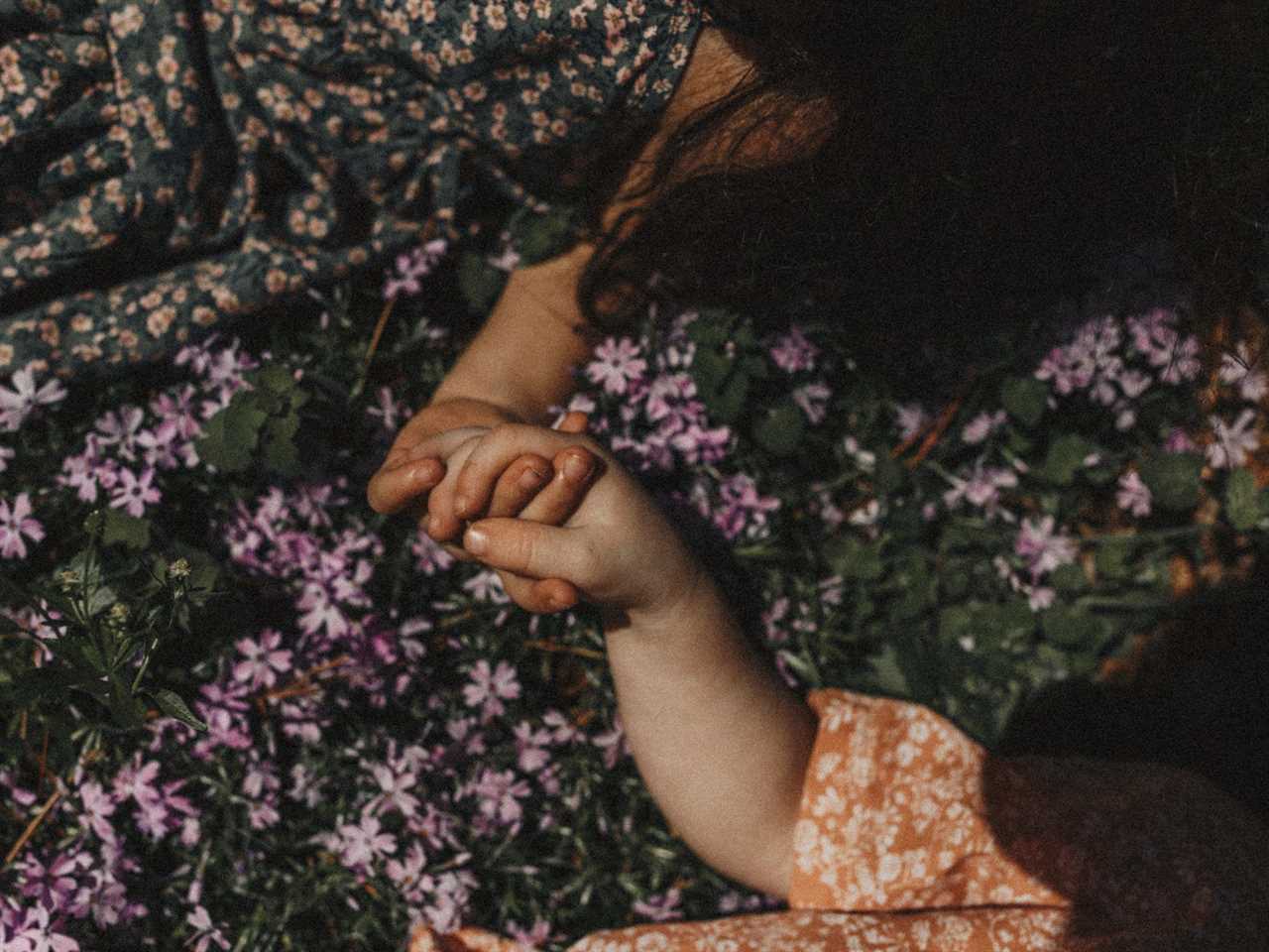 children holding hands in a flower field in Clarksville, Tennessee.