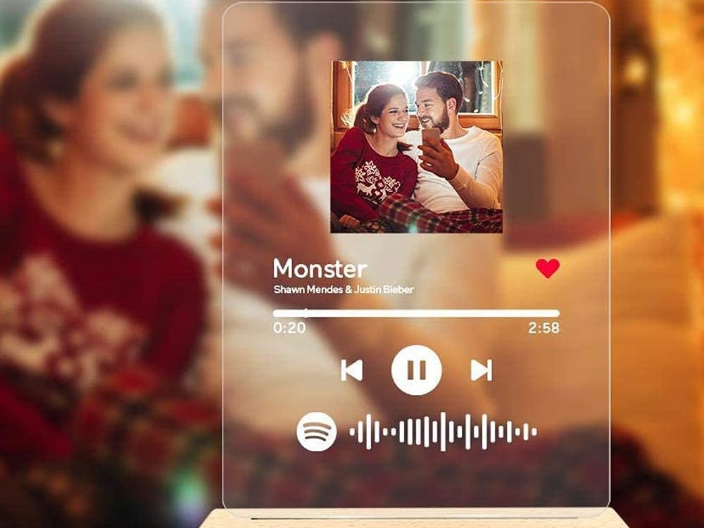 clear acrylic plaque personalized with a photo of a couple and the song "Monster" by Justin Bieber and Shawn Mendez, featuring a scannable Spotify code to the song.