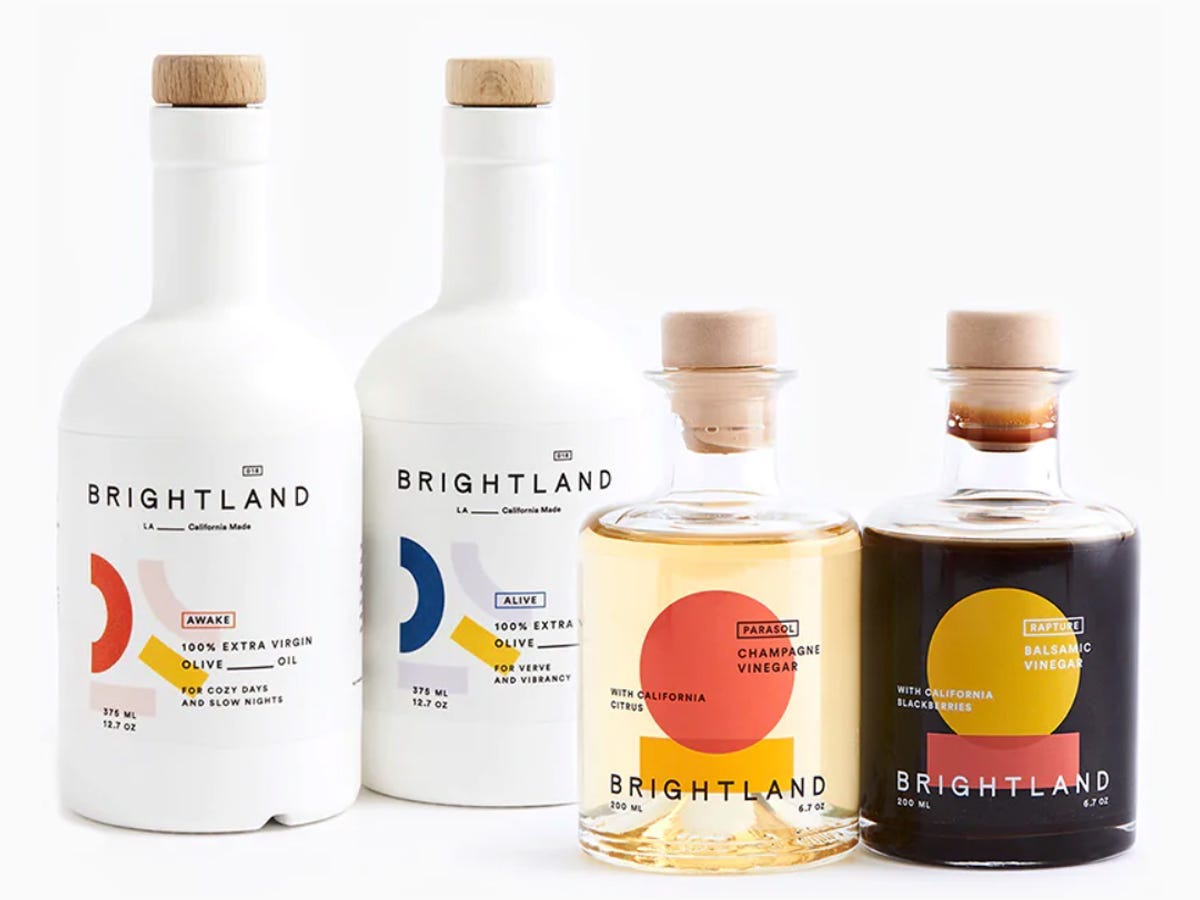 Bottles of oil and vinegar from Brightland essential capsule set in awake, alive, rapture and parasol