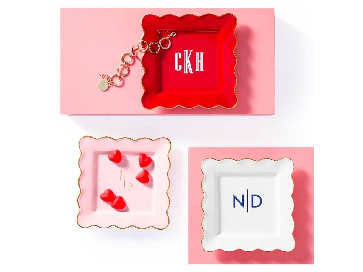 Three Scalloped Ceramic Catchall dishes in red, white, and pink, each with a monogram.