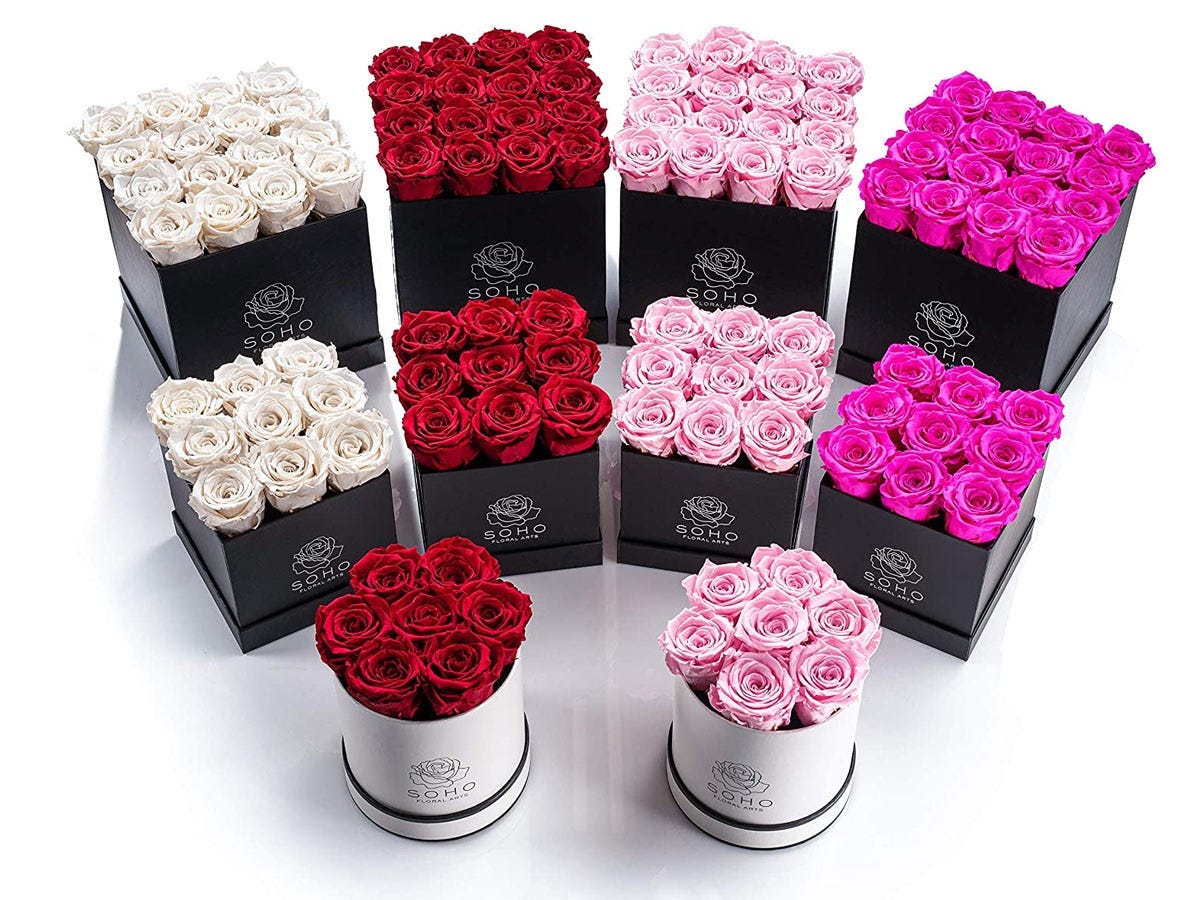 Hot pink, light pink, red, and white floral bouquets arranged in square and circular boxes.