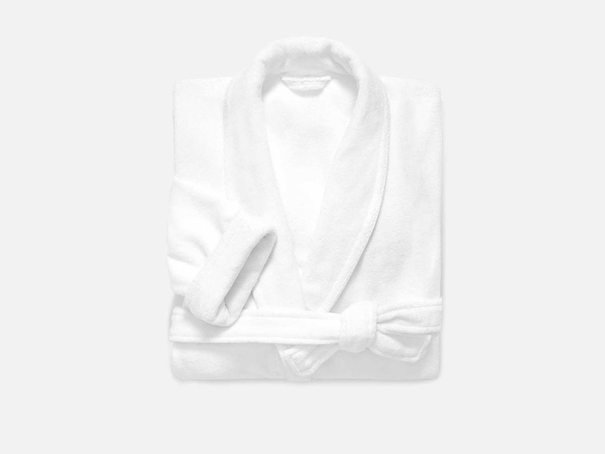 A folded white brooklinen robe.