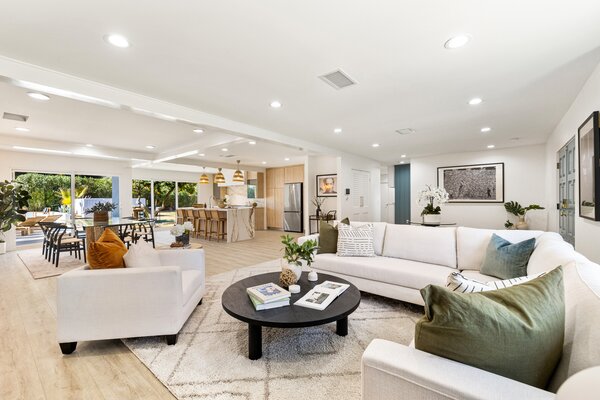 Inside, a large, open floor plan unites the main living areas, catering to easy entertaining.