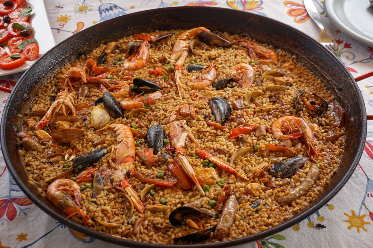 seafood paella in a pan on a table at one of the restaurants frederick md