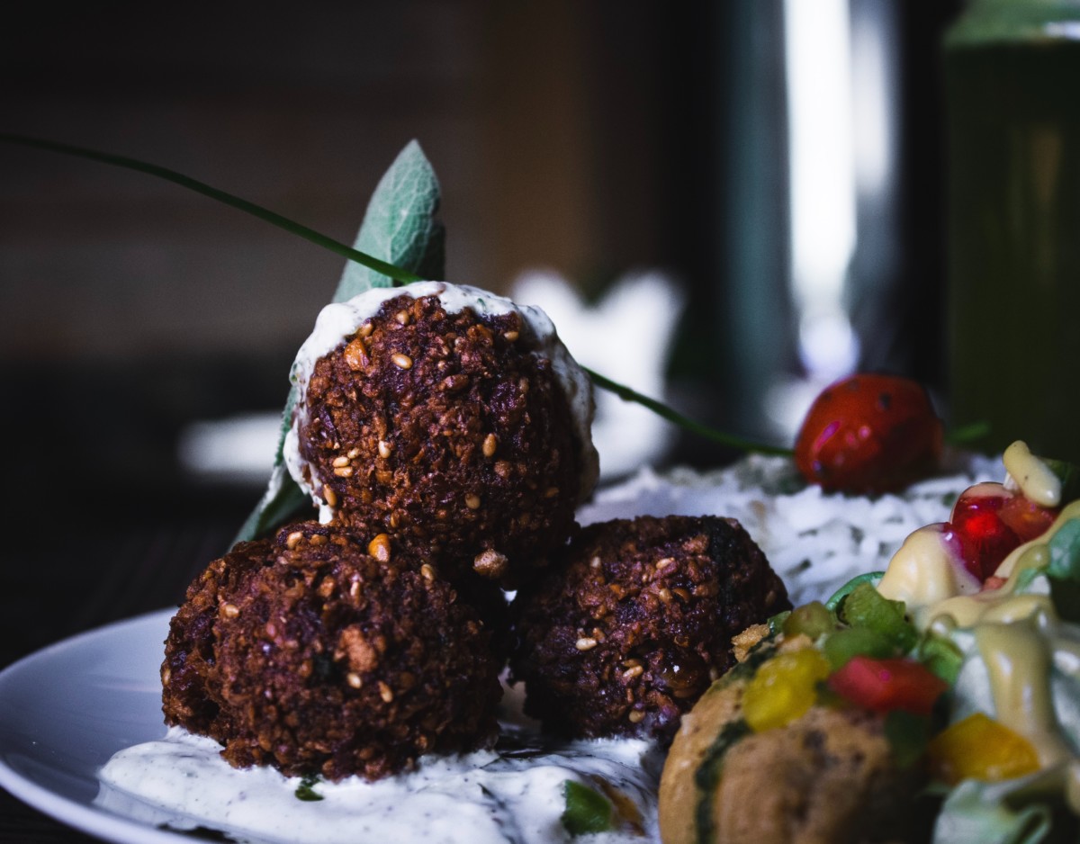 falafels on a plate with toppings at one of the cambridge restaurants