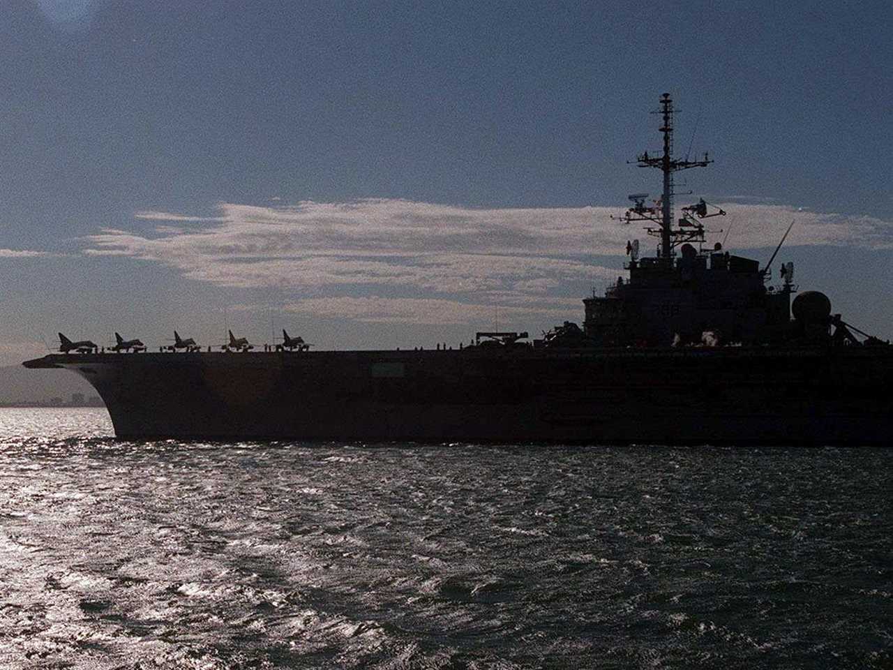 Five of 12 Super Etandard fighter bombers carried aboard the French aircraft carrier Foch are silhouetted against the morning sun as the Foch makes its way out of Cape Town harbour on its way to Rio de Janeiro 27 March 2000.