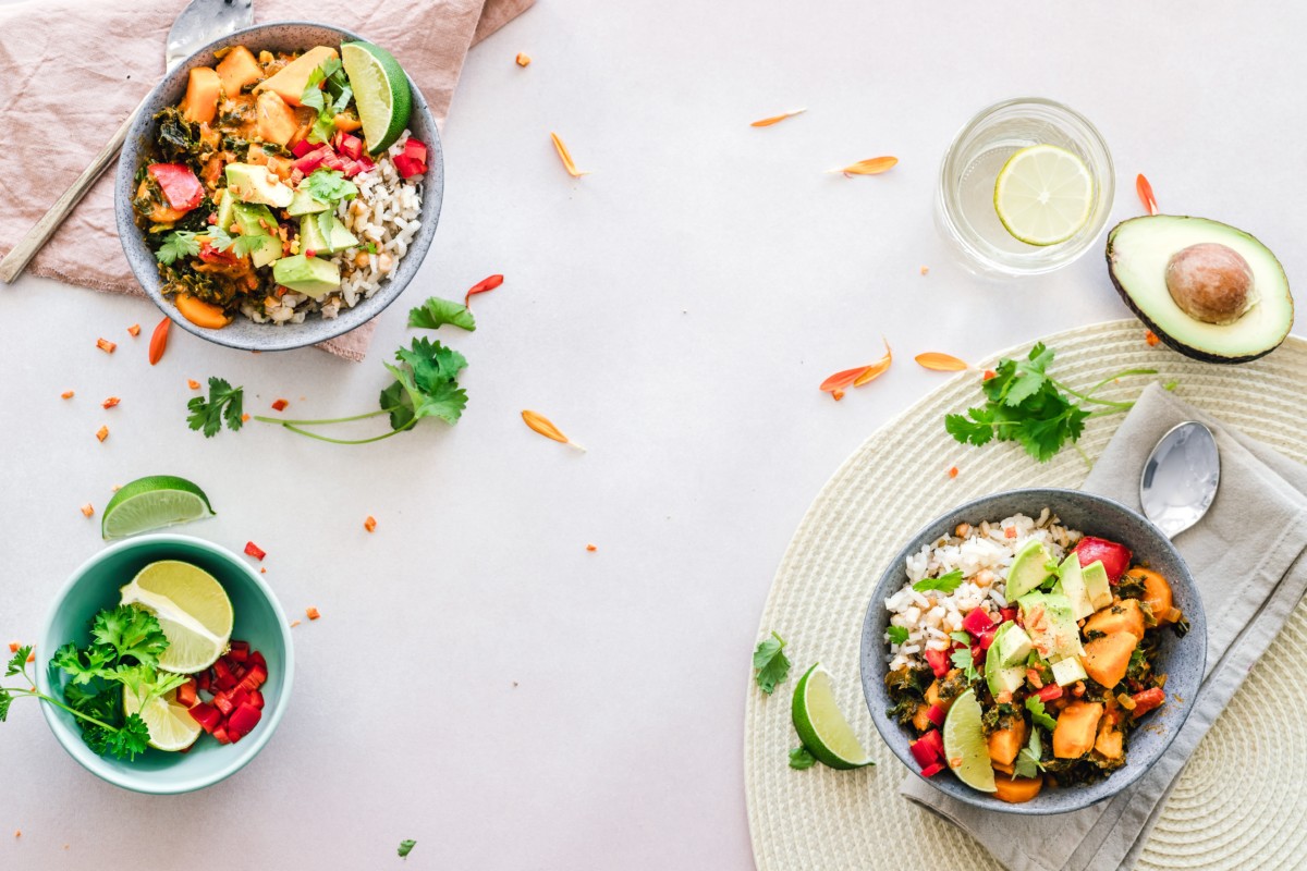 two salads with lots of vegetables