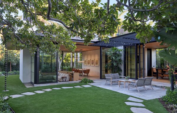 Architect Tom Kundig set the living-dining room in a pavilion that opens to the garden on three sides. 