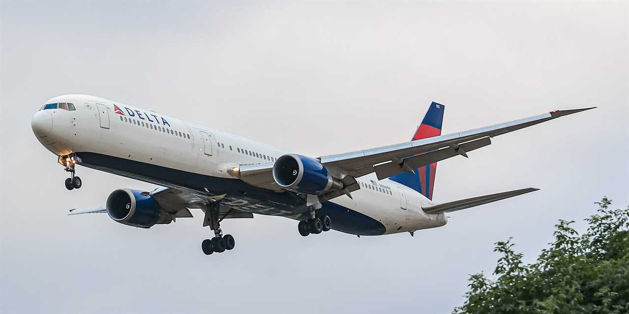 Delta Air Lines wide-body Boeing 767-400 airplane with tail number N836MH landing at London Heathrow Airport in the UK