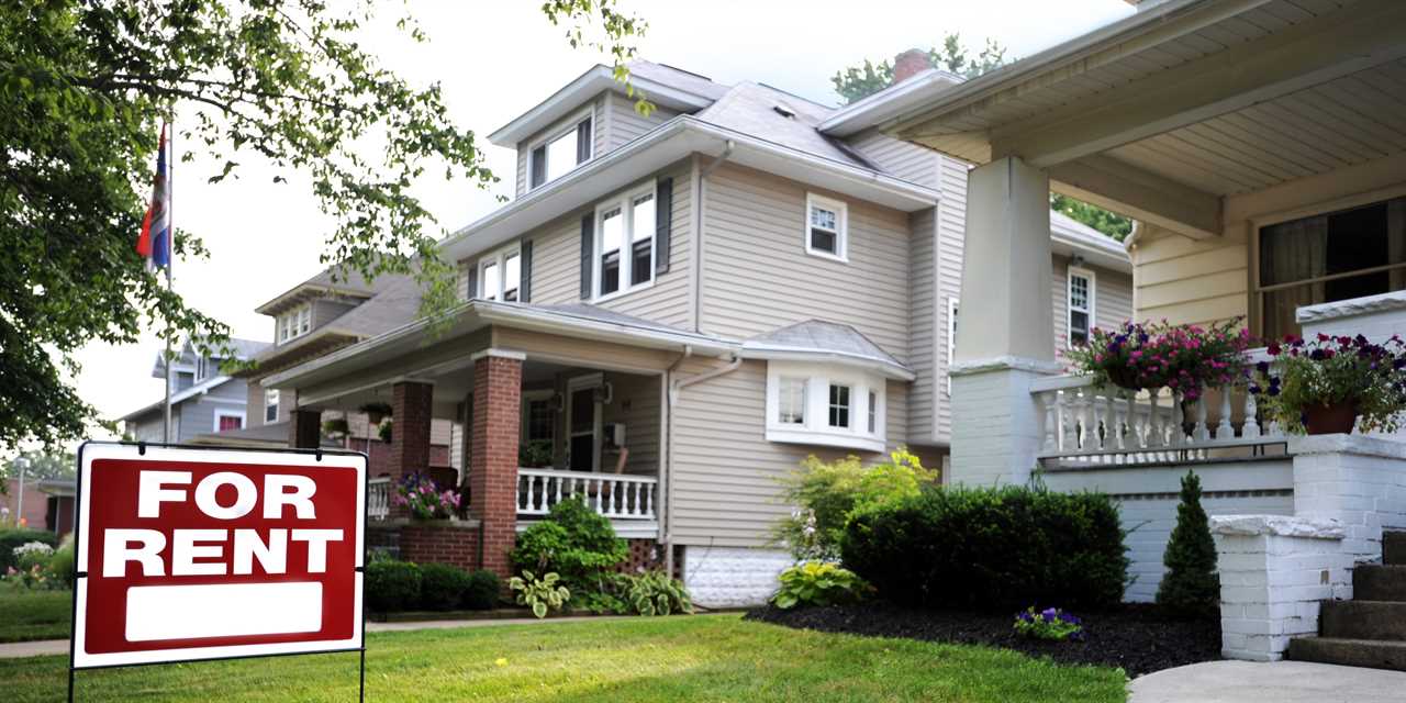 A for-rent sign in front of a suburban house in the US