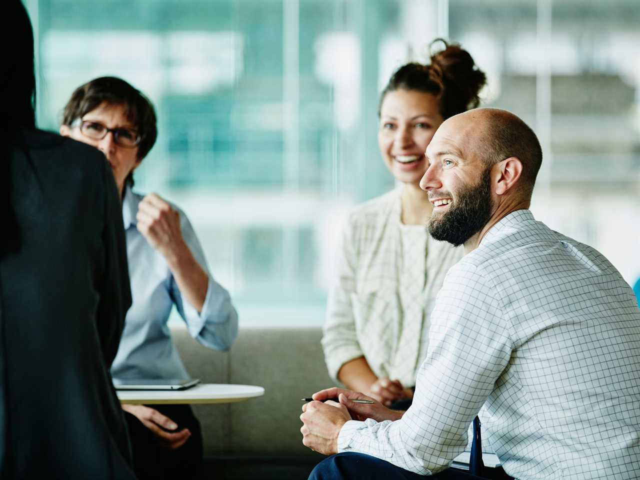 Businessman in discussion with colleagues - stock photo