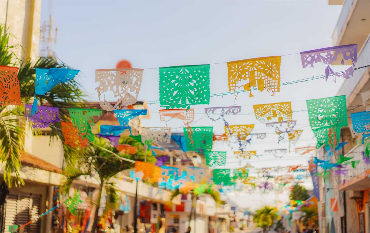 Colorful flags are waving on the street of a small town