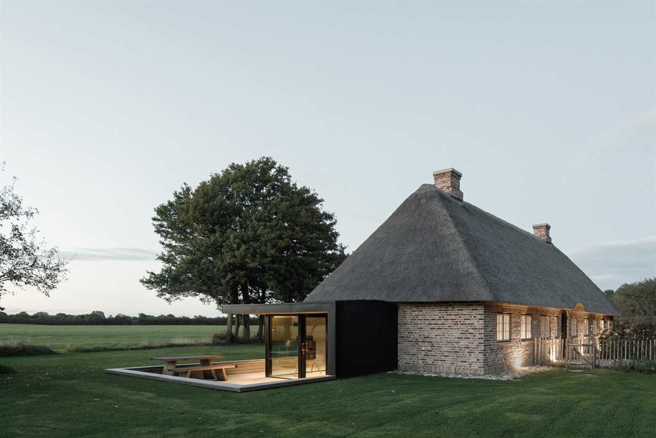 A Dilapidated 1800s Farmhouse Is Revived With a New Thatched Roof and a More Open Plan