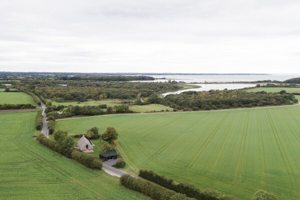 A Dilapidated 1800s Farmhouse Is Revived With a New Thatched Roof and a More Open Plan