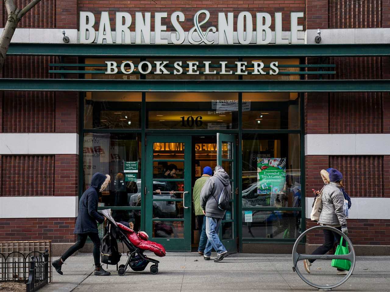 Pedestrians walk by a Barnes & Noble store