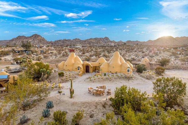 Set on a two-acre lot filled with native vegetation, the dome compound offers convenient access to downtown Joshua Tree, as well as numerous trails for hiking and rock-climbing.