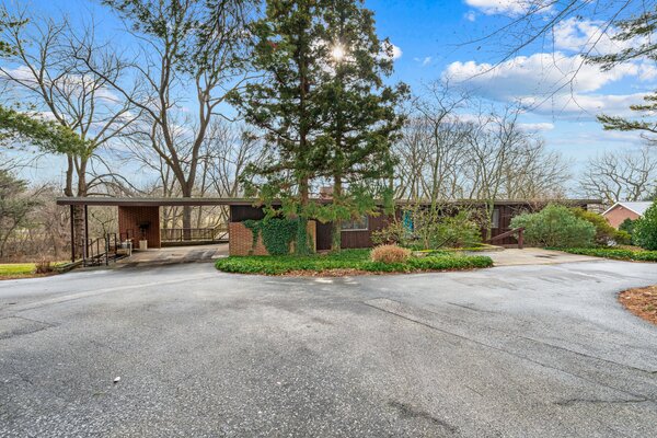 Due to the home being nestled into hillside, it appears to be only one story from street-view.