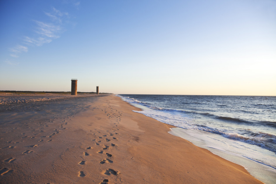 Lookout tower on the beach next to the sea