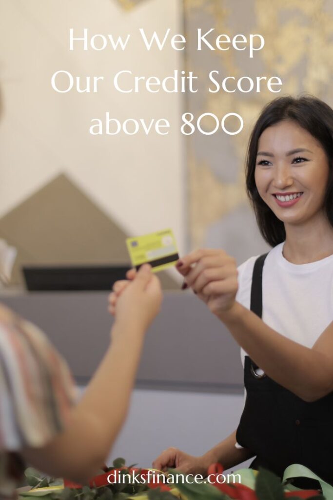 Woman returning a credit card to a customer