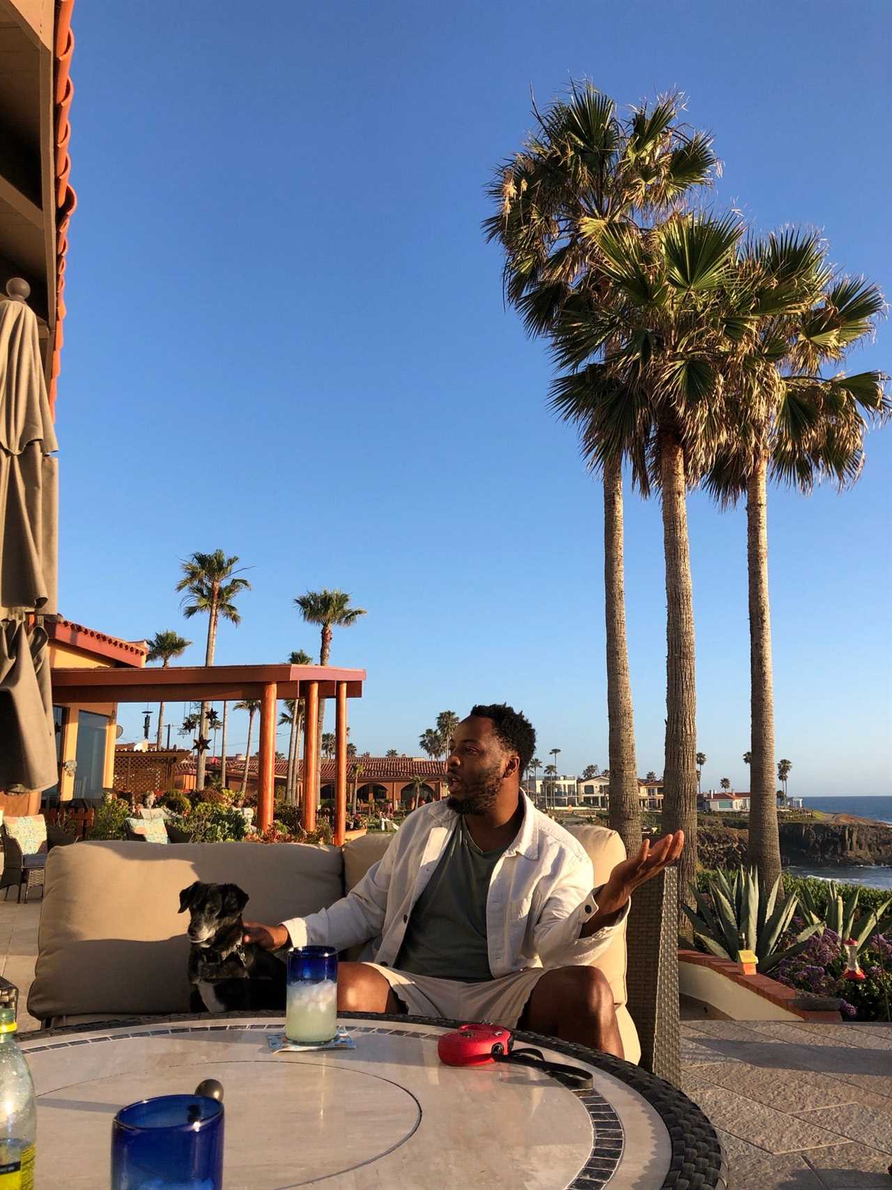 Solomon on a balcony with palm trees