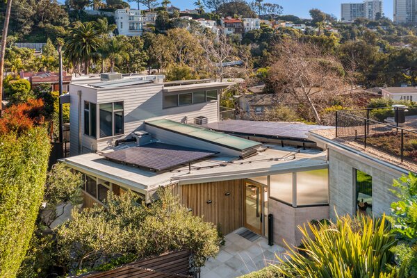 Thick vegetation surrounds the historic home, enhancing its overall sense of privacy.