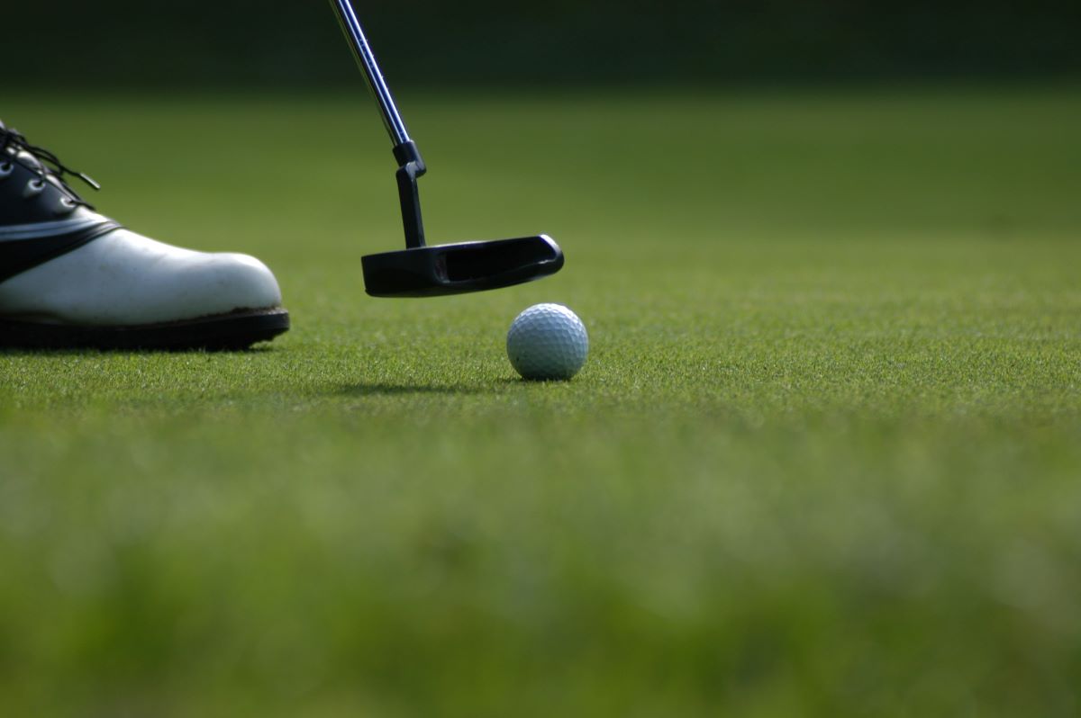 golfer putting on a golf course