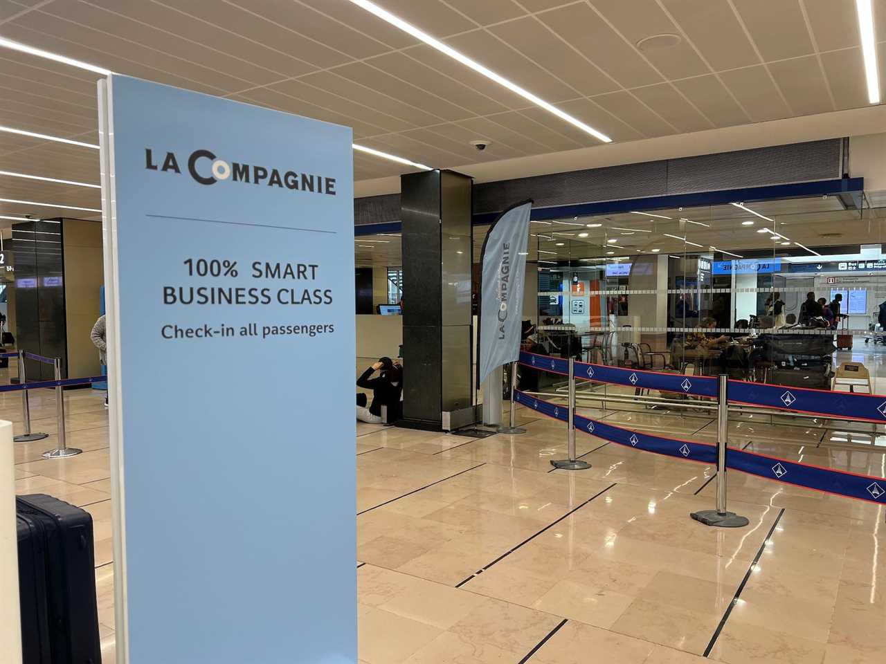 Flying on La Compagnie all-business class airline from Paris to New York — at the check-in counter in terminal 4.