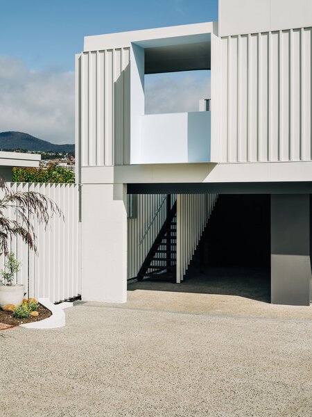 A Crisp White One-Bed Addition Is Parked Atop a Two-Car Garage in Tasmania