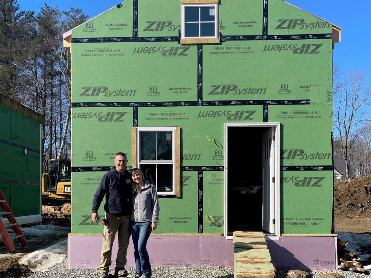 John and Maggie Randolph in front of one of the tiny homes in the tiny-home community they are building in Dover, New Hampshire.