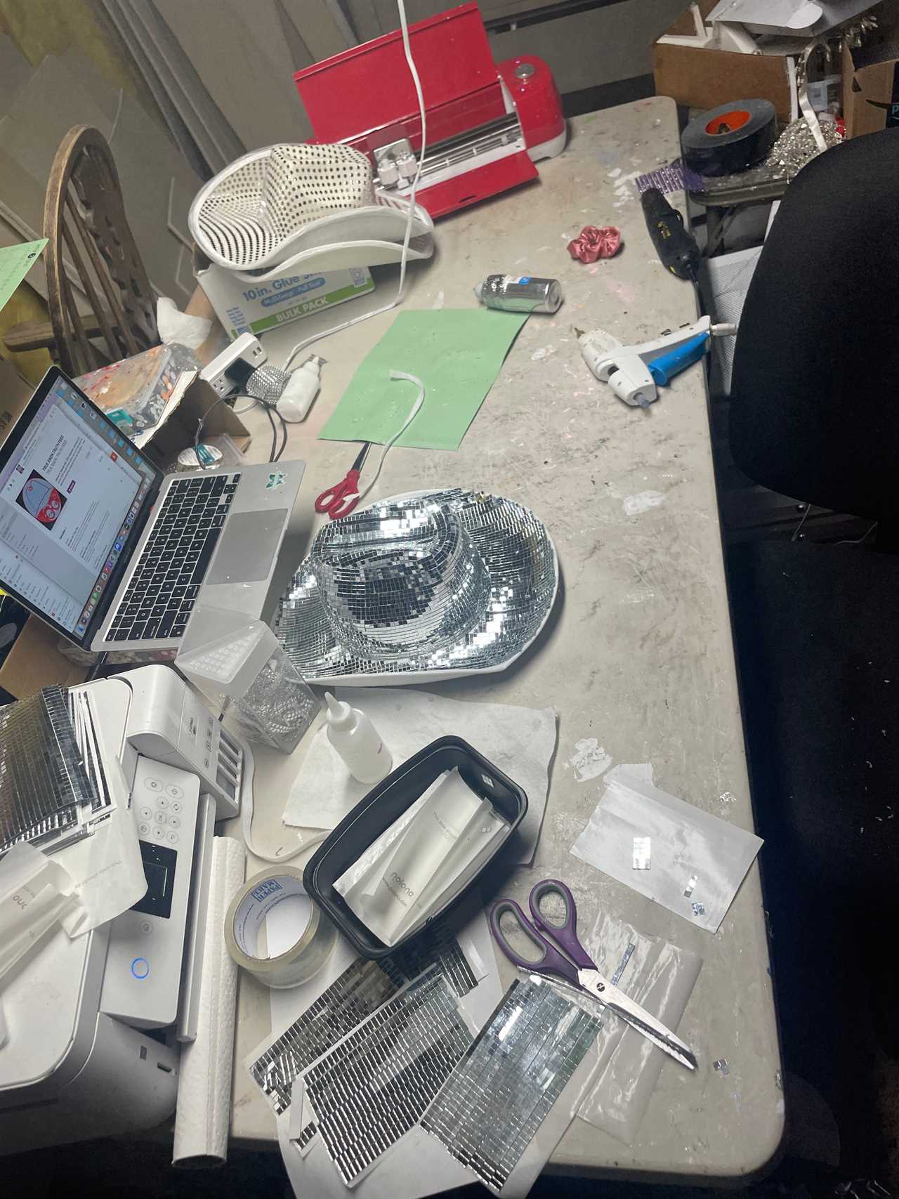 a table set up with hat making supplies