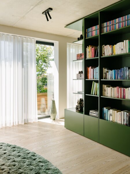 A Big Green Box Adds Flair and Function to an Open-Plan Berlin Apartment