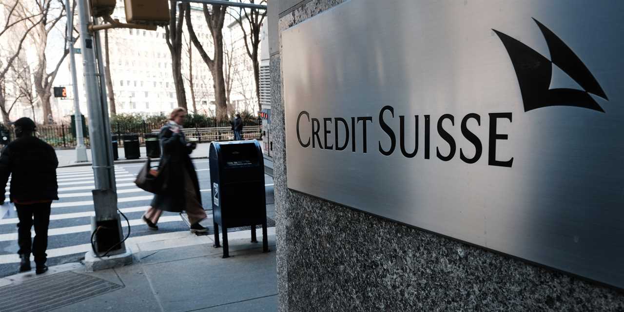 People walk by the New York headquarters of Credit Suisse on March 15, 2023 in New York City. After its largest shareholder said it could not provide further support, Credit Suisse shares fell by as much as 30% on Wednesday as global concerns over the stability of major banks continued to spread.