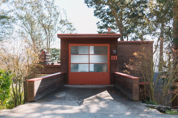 Neatly nestled into a city hillside, the historic home hides its multilevel design from street-view.