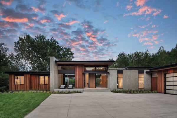 The site and existing driveway were minimally disturbed while relocating the garage and opening up the horizontal sight lines.