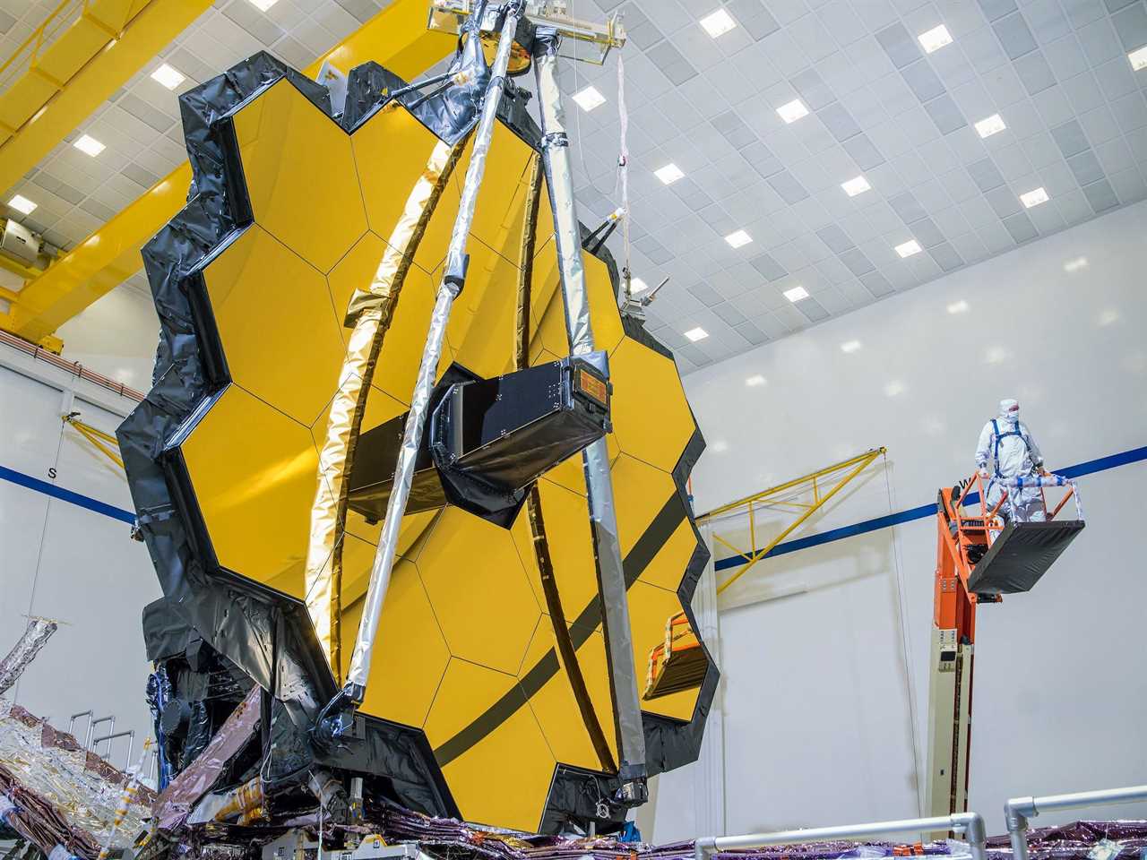 james webb space telescope gold octagon mirror in large white cleanroom