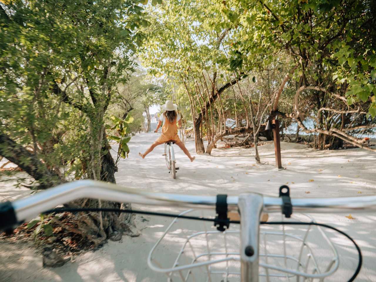 Couple cycling through Honeymoon Island in Florida on a luxury vacation