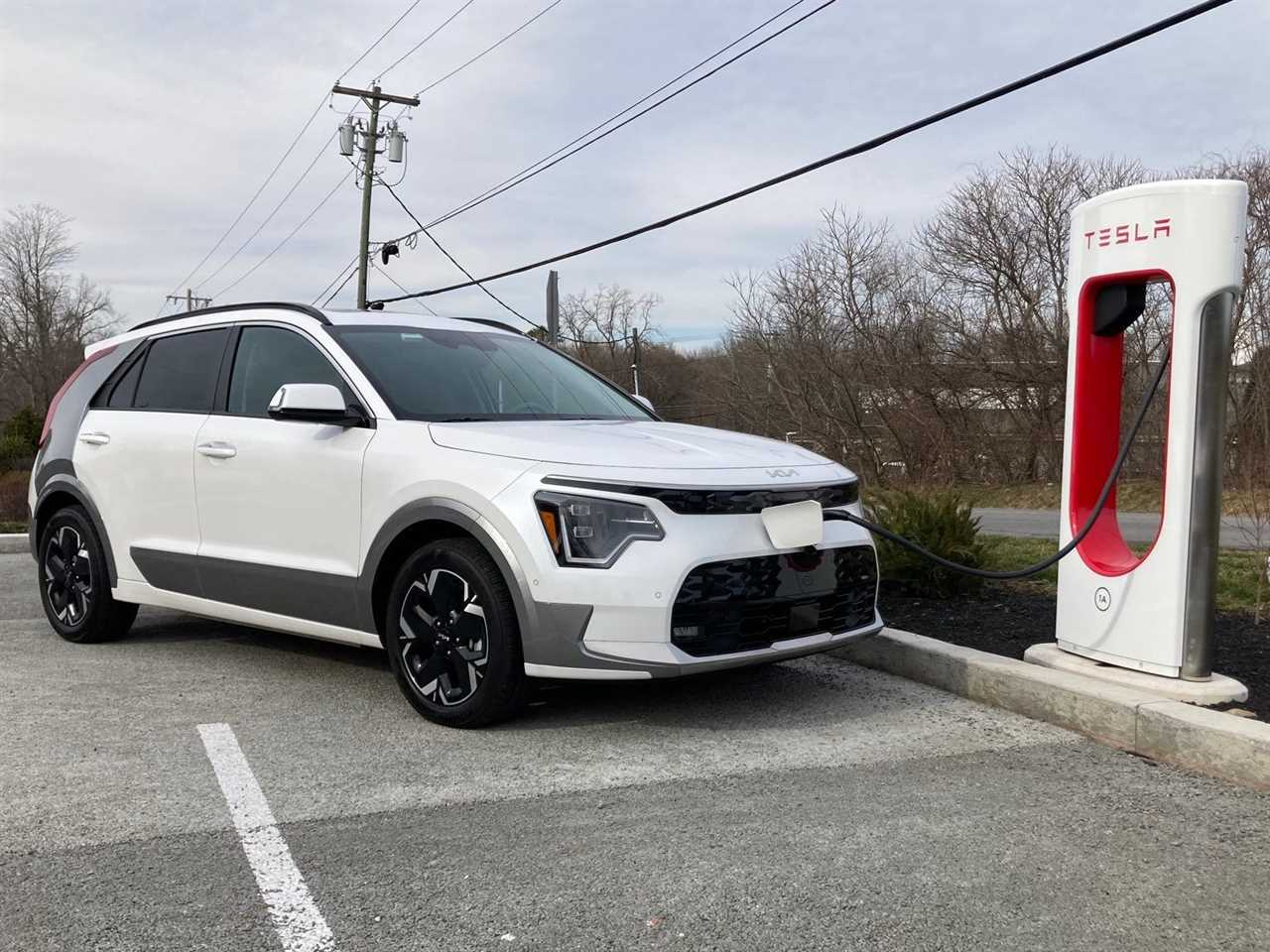 The Kia Niro EV charges at a Tesla Supercharger in Brewster, NY.