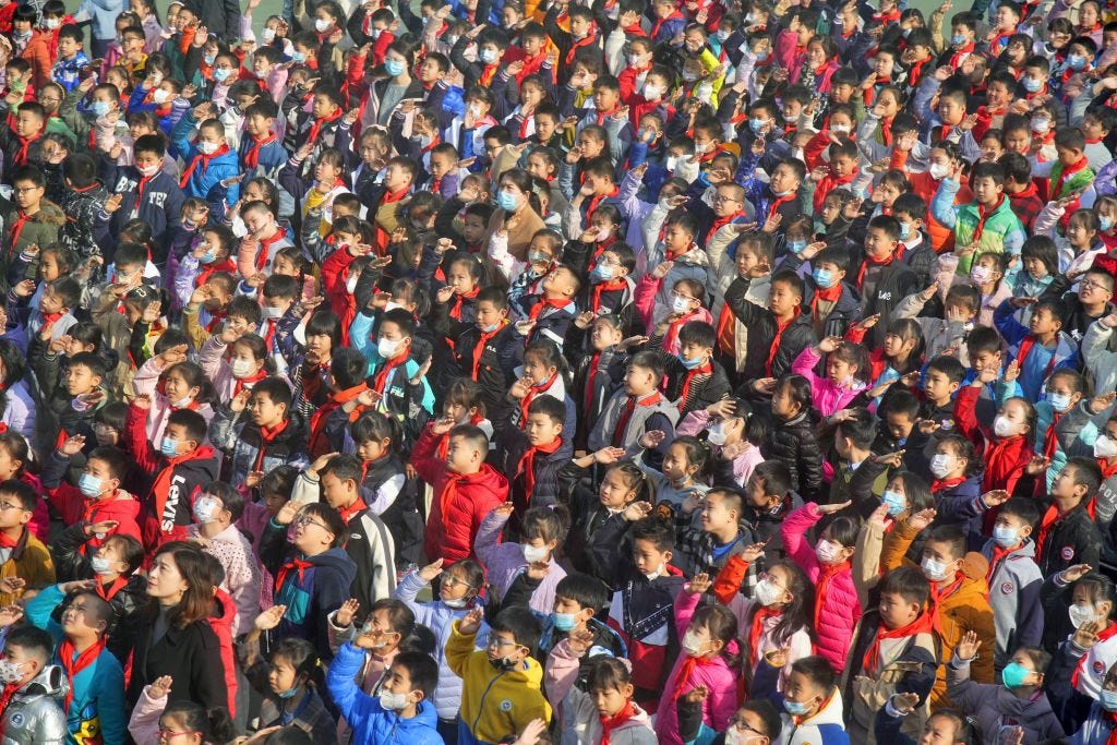 Primary school students salute during the national flag raising ceremony in Yantai, East China's Shandong Province.