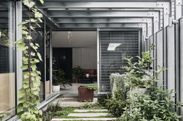 Steel Cladding and a Roller Door Forge a Melbourne Home With Its Industrial Setting